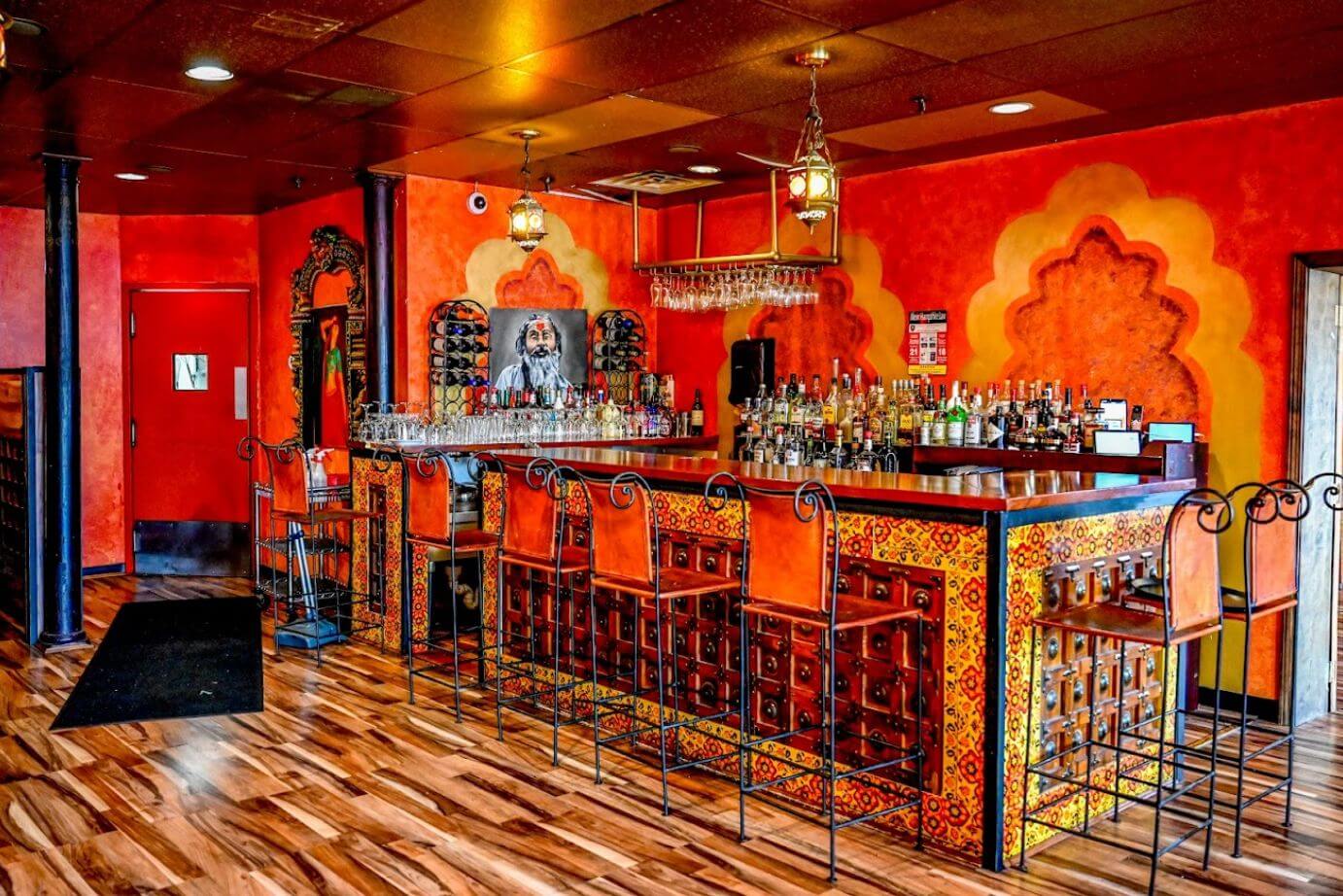 The bar at India Palace with hand-carved Indian details